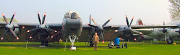  man posing with aircraft for photo.