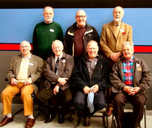  men posing for photo.