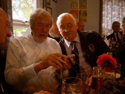 74th Entry how does this work then?. Three men looking at a camera.