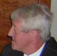 Man sat at a dinner table.