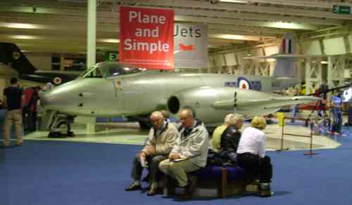 A group of people sitting on a bench.