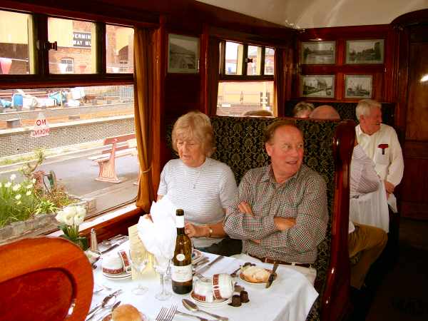 Slim in a train at bridgenorth. man and woman sitting in a railway carriage.